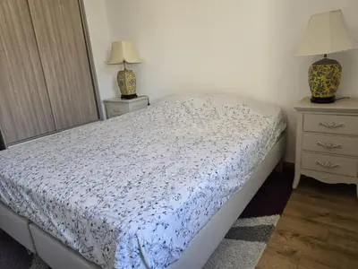 a bedroom with a bed and two night stands at 3 Bedroom House Terrace Park & Free Parking in Aix-en-Provence
