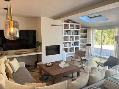 a living room with a couch and a table at Saint-Jean-des-Cèdres in Aix-en-Provence