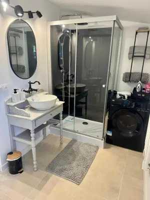 a bathroom with a sink and a washing machine at Maset Lou Pitchoun in Saint-Rémy-de-Provence