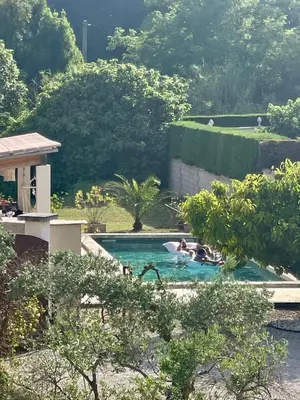 a group of people in a swimming pool at Belle bastide provençale in Noves