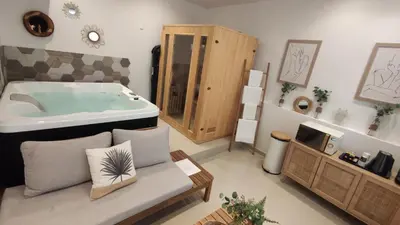 a large bathroom with a tub in the middle at Entre Sorgue et sens in LʼIsle-sur-la-Sorgue