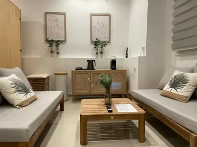 a living room with two couches and a coffee table at Entre Sorgue et sens in LʼIsle-sur-la-Sorgue