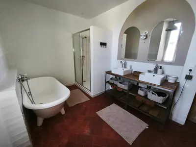 a bathroom with a toilet and a sink and a tub at La dominique in Villes-sur-Auzon