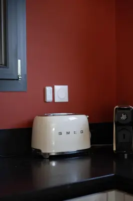 a white toaster sitting on top of a kitchen counter at Magnifique Villa à 5 minutes d'Aix in Aix-en-Provence
