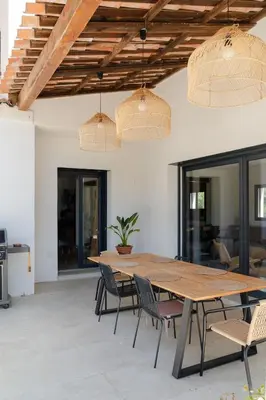 a dining room with a wooden table and chairs at Magnifique Villa à 5 minutes d'Aix in Aix-en-Provence