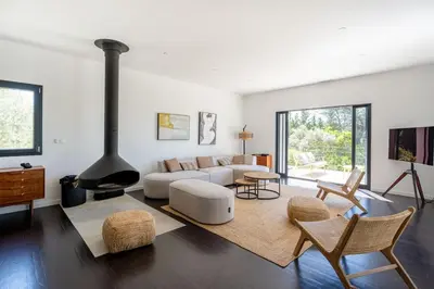 a living room with a couch and a fireplace at Magnifique Villa à 5 minutes d'Aix in Aix-en-Provence