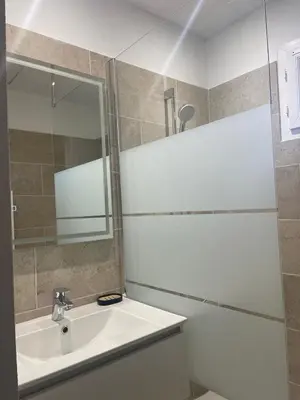 a bathroom with a bath tub and a sink at Douceur de vivre en Provence in Saint-Saturnin-lès-Avignon