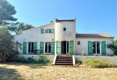a large white house with green shutters at Casa Corniou - Calme, Village Provençal, 3 chambres, 2 SDB, 8 personnes in Cornillon-Confoux