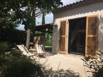 two lawn chairs sitting in front of a house at Le clos de la Touloubre in Aix-en-Provence
