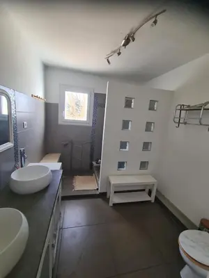 a large bathroom with two sinks and a tub at Villa avec piscine en Provence in Pernes-les-Fontaines