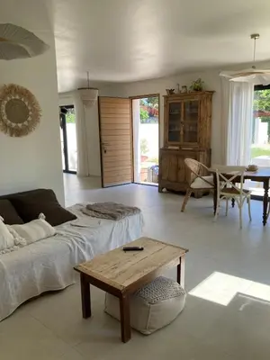 a living room with a couch and a table at La Petite Bastide en Provence in Noves
