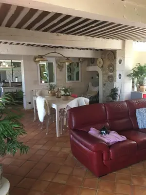 a living room with a couch and a table at Maison typique provençale au calme absolu dans le triangle d or a Bonnieux in Bonnieux