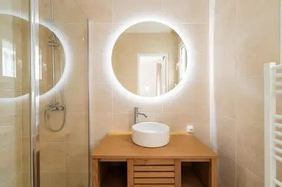 a bathroom with a sink and a mirror at Villa & Piscine 8P entre Isle sur Sorgue et Avignon in Caumont-sur-Durance