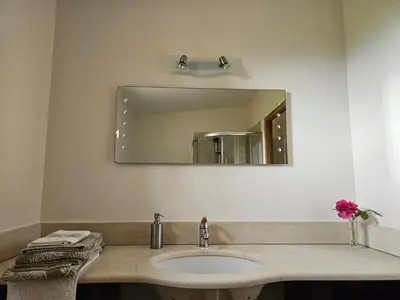 a bathroom with a sink and a mirror at Vues imprenables, calme, nature, confort in Bonnieux