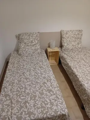 two beds sitting next to each other in a bedroom at Provencal-style villa in Morières-lès-Avignon