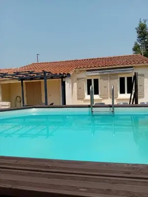 a large swimming pool in front of a house at Provencal-style villa in Morières-lès-Avignon