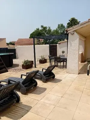 a group of chairs sitting on a patio at Provencal-style villa in Morières-lès-Avignon