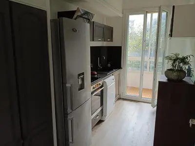 a kitchen with a refrigerator and a stove at 2 bedroom apartment in the city center in Aix-en-Provence