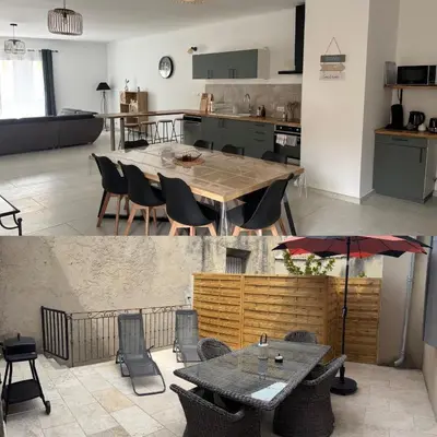 a kitchen and a living room with a table and chairs at Appartement 100 m carré pour 6 à 8 personnes in Saint-Cannat