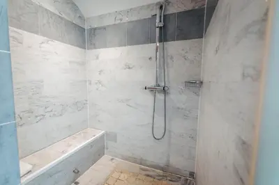 a bathroom with a shower with a tub and a sink at La Bastide de Paula in Aix-en-Provence