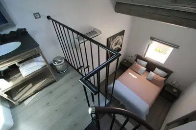 an overhead view of a bedroom with a bed at Le moulin vieux, mas authentique en Provence avec piscine in Entraigues-sur-la-Sorgue