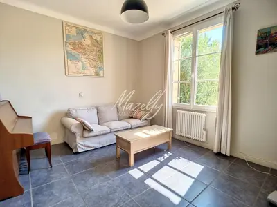 a living room with a couch and a table at La Villa Luberonnaise in Robion en Luberon