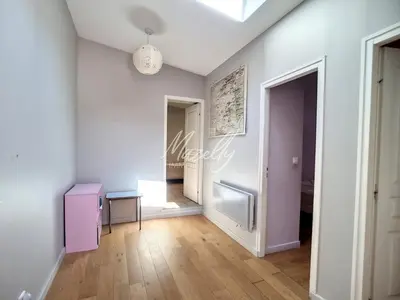a living room with a table and a hallway at La Villa Luberonnaise in Robion en Luberon
