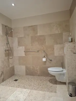 a bathroom with a shower and a toilet in it at logement indépendant avec terrasse privative dans les Alpilles in Aureille