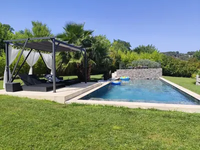 a swimming pool with a gazebo in a yard at Aloha in Aix-en-Provence