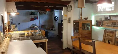 a kitchen with a sink and a counter top at Maison de famille traditionnelle provençale in Gordes