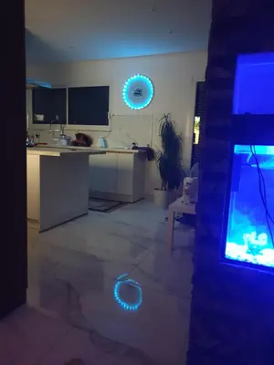 a living room with a kitchen with a fish tank at Villa in Carpentras