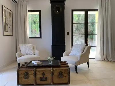 a living room with two chairs and a trunk at Peaceful Studio With Private Pool In Luberon in Ansouis