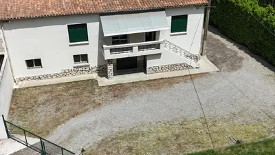 an overhead view of a white building with green windows at Parenthèse à la Maison de Gilda in Eygalières