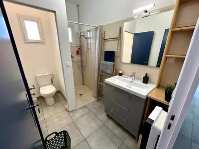 a bathroom with a sink and a toilet and a shower at Parenthèse à la Maison de Gilda in Eygalières
