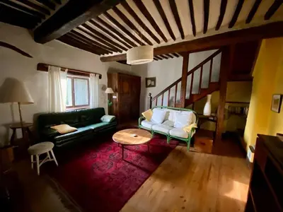 a living room with a couch and a table at Maison de village, piscine, Colorado in Rustrel