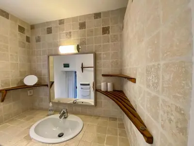 a bathroom with a sink and a mirror at Maison de village, piscine, Colorado in Rustrel