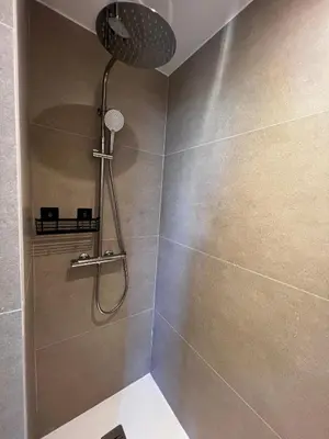a shower with a shower head in a bathroom at Studio Avignon MONTFAVET in Avignon