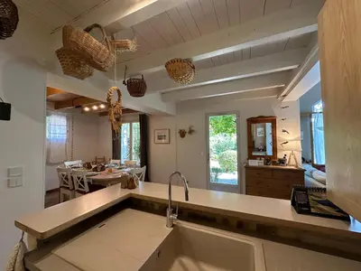 a kitchen with a sink and a counter top at La Maison du Petit Hérisson de 170 m2 avec jardin parking accueil de 6 personnes barbecue in Aix-en-Provence