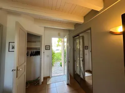a hallway with a door leading into a room at La Maison du Petit Hérisson de 170 m2 avec jardin parking accueil de 6 personnes barbecue in Aix-en-Provence