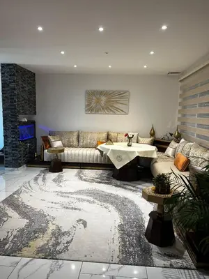 a living room with a couch and a table at Belle villa à Carpentras in Carpentras