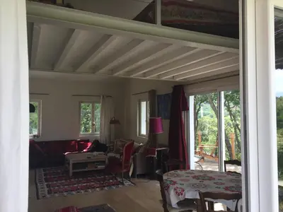 a living room with a couch and a table at maison de charme en Luberon in Gignac