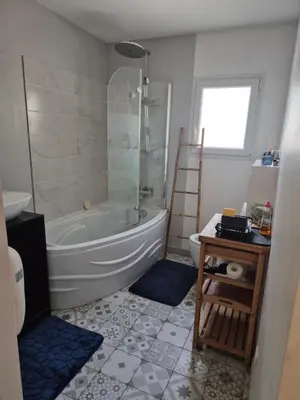 a bathroom with a tub and a toilet and a sink at Chambre meublé Eden à Noves in Noves
