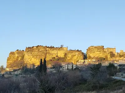 a view of a rocky mountain with a city at Charming house in Provence, 2 to 10 people in Saignon