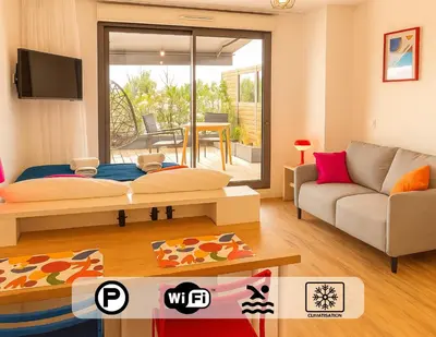 a living room with a bed and a couch at Ma place au sud 216 in Éguilles