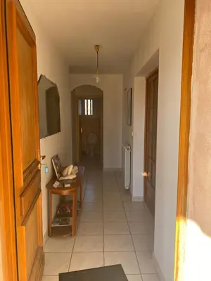 a room with a hallway with a television and a door at Villa de l'Argau in Revest-du-Bion