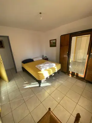 a bedroom with a bed in the corner of a room at Villa de l'Argau in Revest-du-Bion
