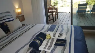 a bedroom with a bed with two towels on it at Studio Business Wi-Fi 7 TVA Proche zones LesMilles La Duranne Aix TGV in Éguilles