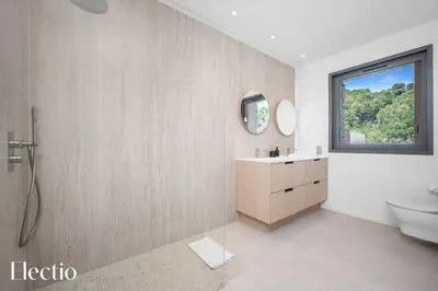 a bathroom with a sink and a toilet and a window at Domaine Bellevue Ste-Victoire View Pools & Cinema in Le Puy-Sainte-Réparade