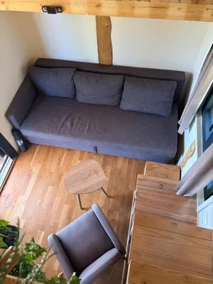 an overhead view of a couch in a living room at La Tiny du Luberon in Pertuis