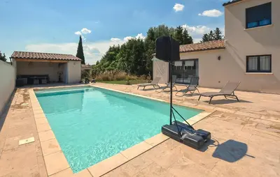 a swimming pool in front of a house at Maison Avec Piscine Privée in Monteux